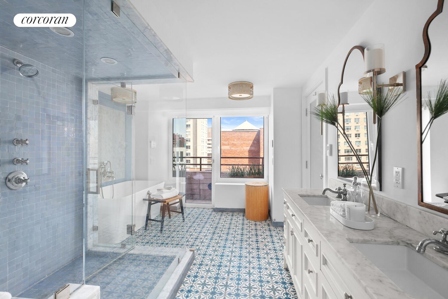 505 East 79th Street, Unit 19B Manhattan, NY 10075 - Photo 8 of 19 a bathroom with a sink a toilet and shower