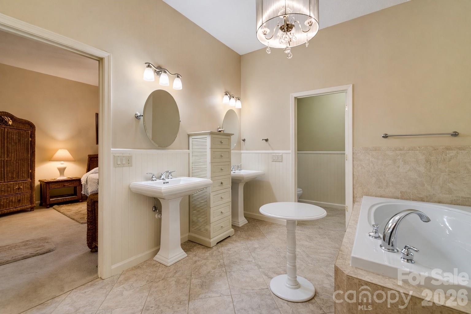 1838 Coman Road Franklin, NC 28734 - Photo 35 of 48 a bathroom with a sink and a mirror