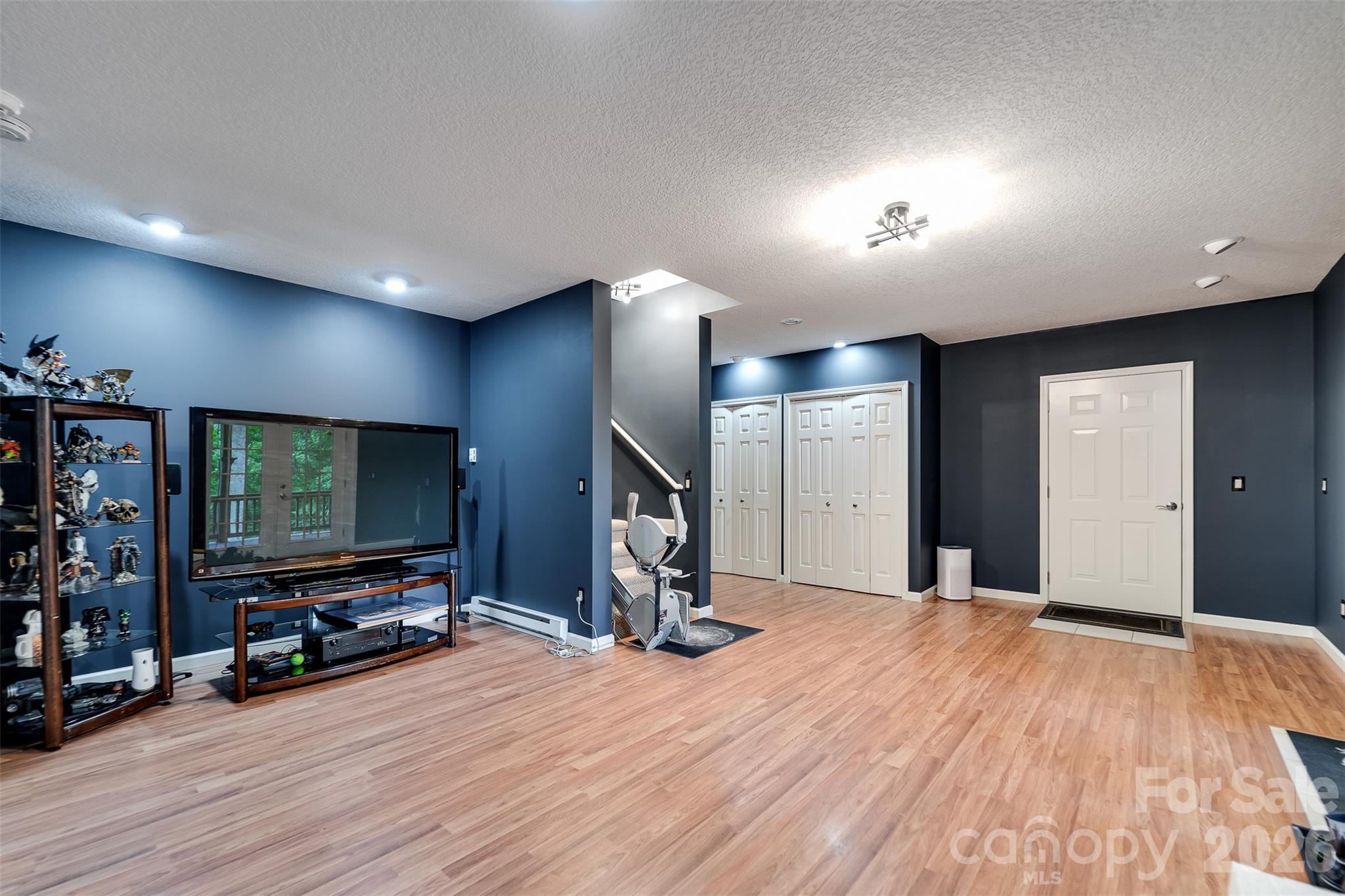 1838 Coman Road Franklin, NC 28734 - Photo 39 of 48 a view of a livingroom with wooden floor and a flat screen tv