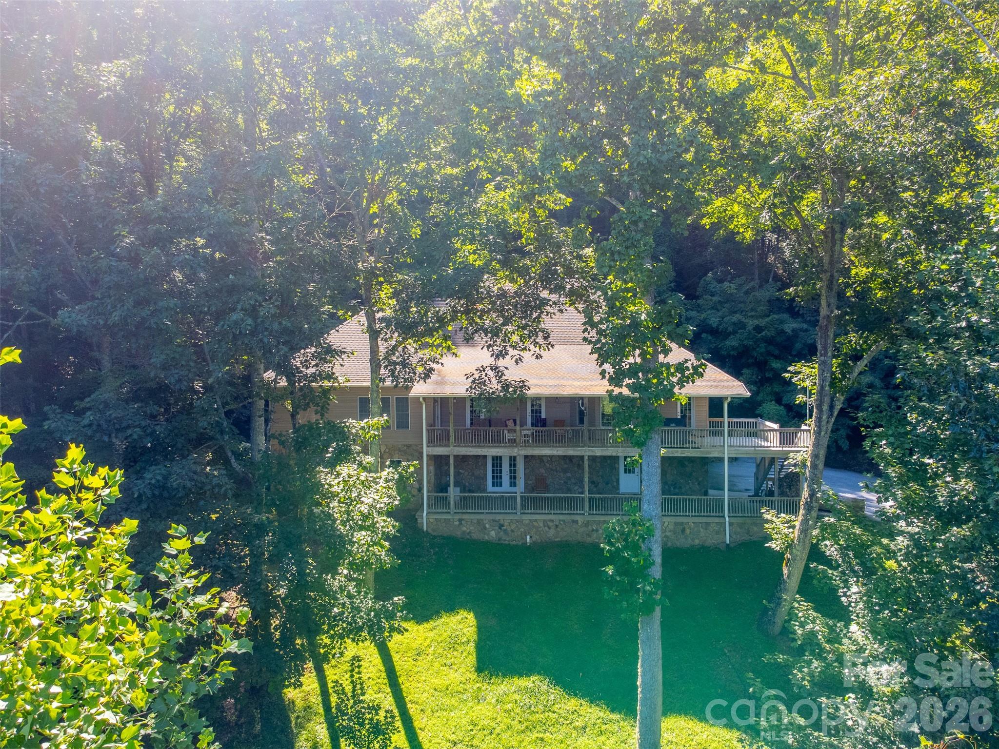 1838 Coman Road Franklin, NC 28734 - Photo 8 of 48 a view of a house with a backyard