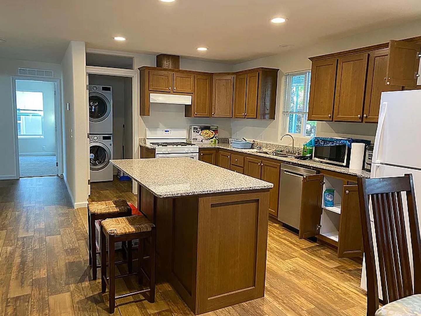 1075 Space Park Way, Unit 134 Mountain View, CA 94043 - Photo 2 of 9 a kitchen with a sink a counter top space stainless steel appliances and cabinets