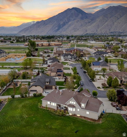 1355 West 1000 South Mapleton, UT 84664 - Photo 60 of 62 Expansive residential property featuring a large, terraced lawn and a multi-level structure with numerous windows