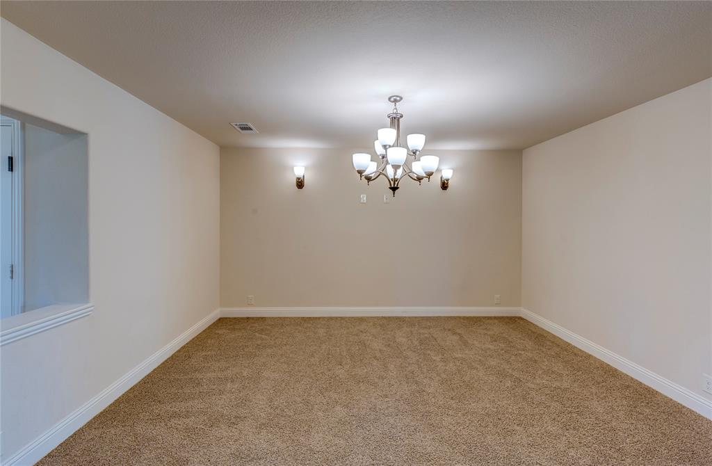 4014 Grove Valley Road Midlothian, TX 76065 - Photo 6 of 7 a view of a room with chandelier fan