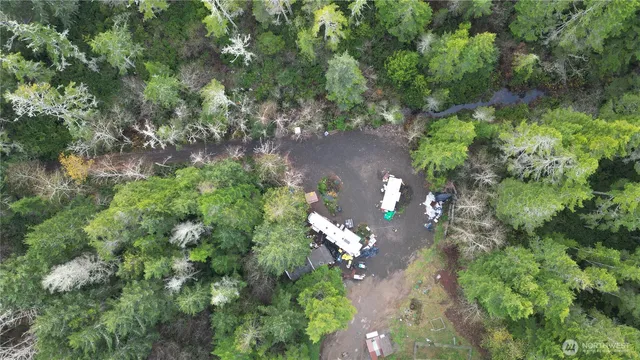 an aerial view of a house with yard and outdoor seating