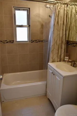 a bathroom with a sink a bathtub and a shower