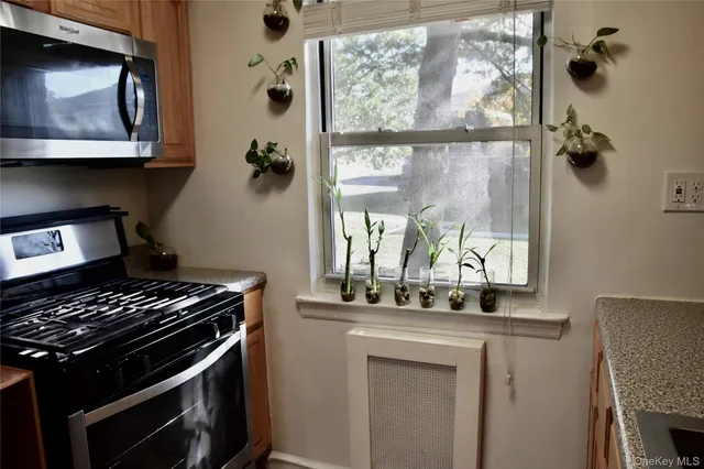 a kitchen with a stove and a microwave