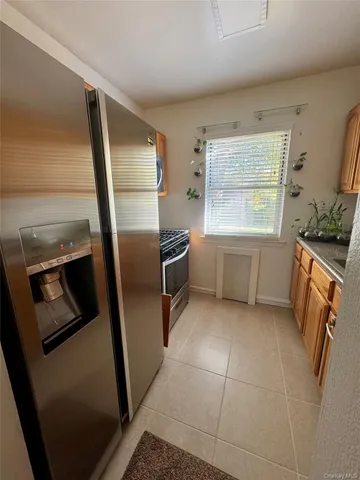 a kitchen with stainless steel appliances a refrigerator and a sink