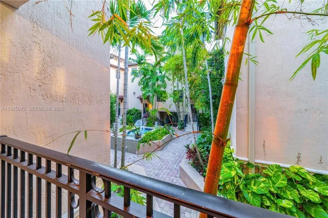 a view of a garden from a balcony