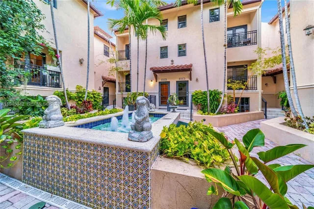 a view of an chairs and table in a patio