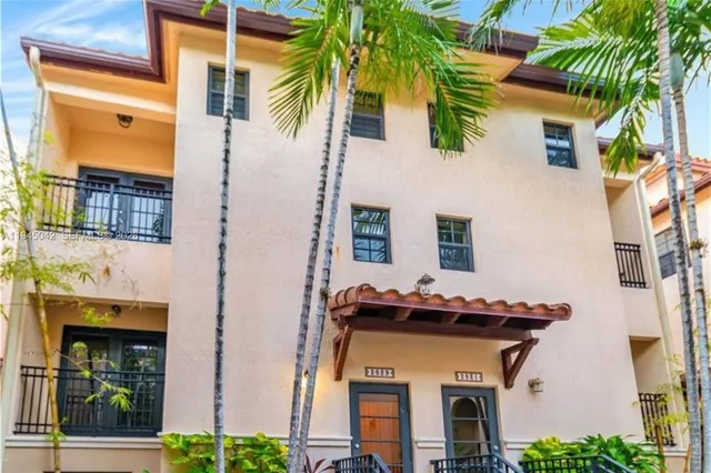 a front view of a house with garage