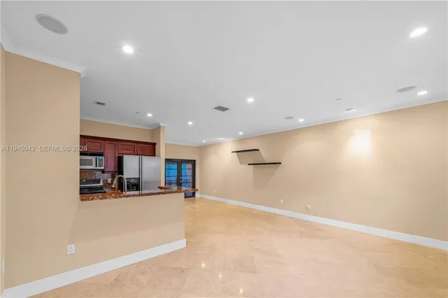 a view of a kitchen with furniture and a kitchen