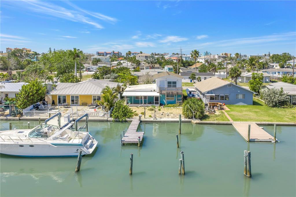 14045 East Parsley Drive Madeira Beach, FL 33708 - Photo 5 of 14 a view of a lake with a house swimming pool and outdoor space