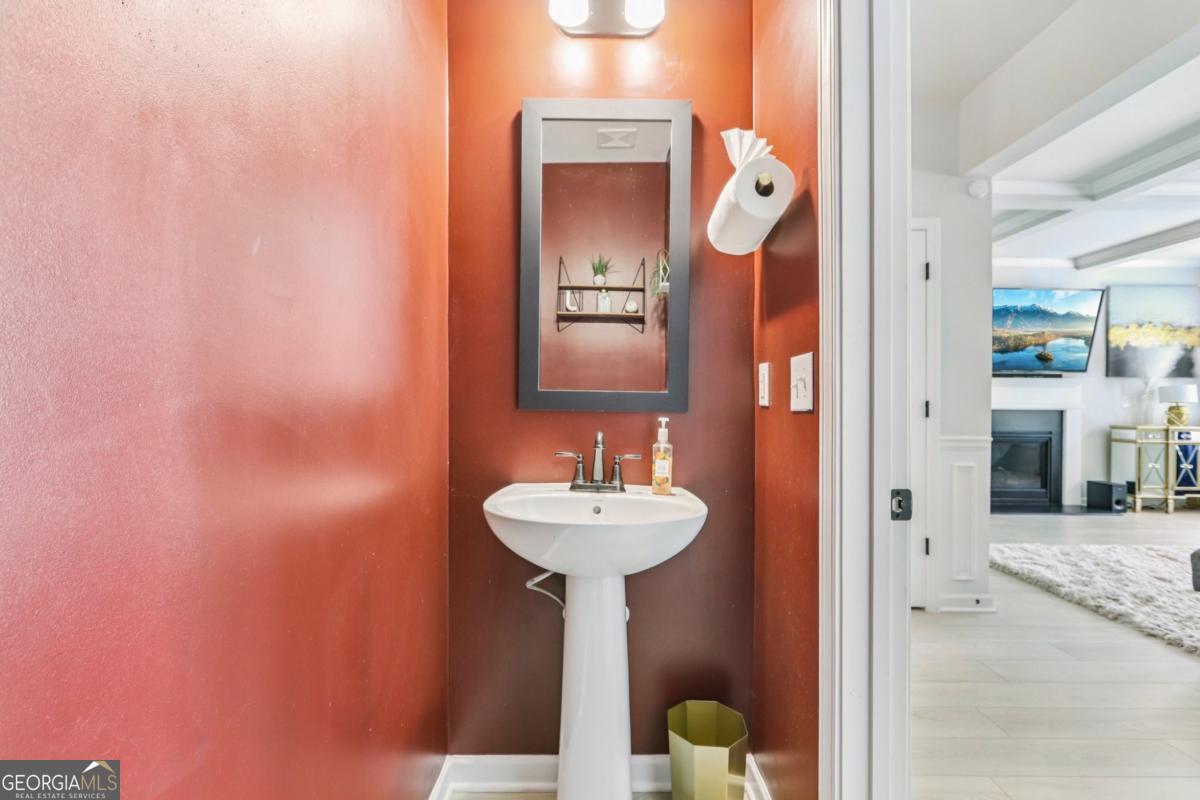 4774 Sultana Way Atlanta, GA 30331 - Photo 11 of 25 a bathroom with a sink and a mirror