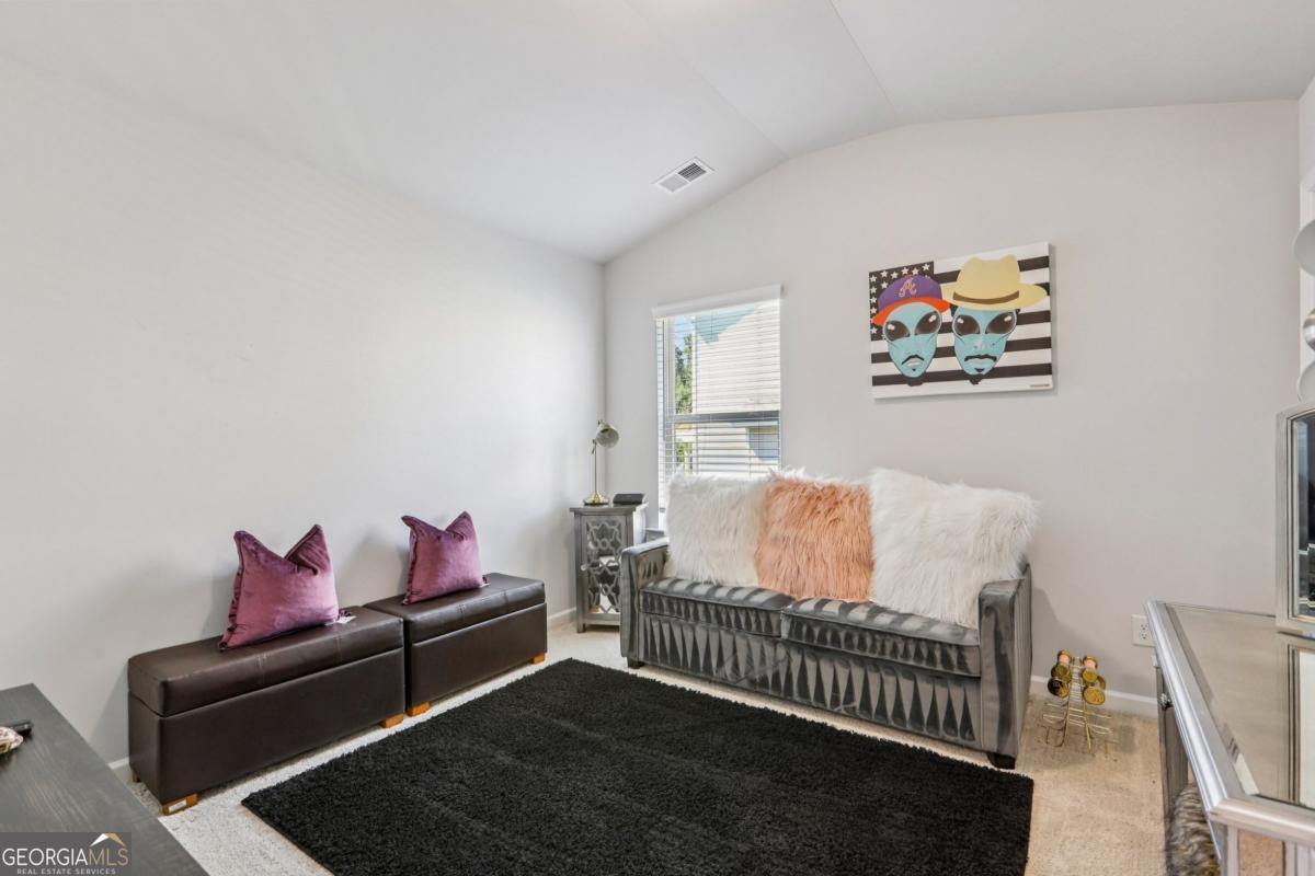 4774 Sultana Way Atlanta, GA 30331 - Photo 13 of 25 a bedroom with furniture and a window