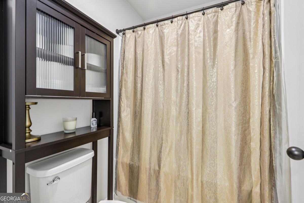 4774 Sultana Way Atlanta, GA 30331 - Photo 17 of 25 a kitchen with a white cabinets and a window