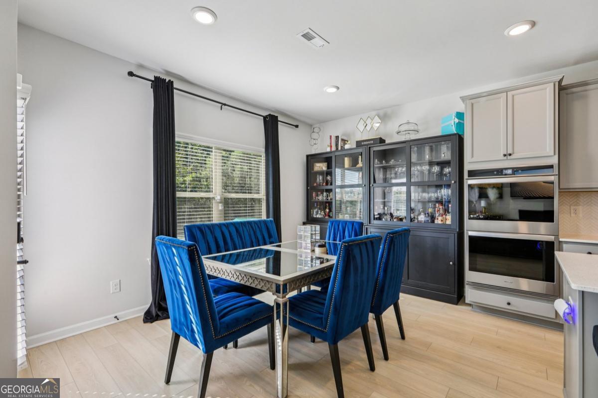 4774 Sultana Way Atlanta, GA 30331 - Photo 10 of 25 a view of a dining room with furniture window and wooden floor