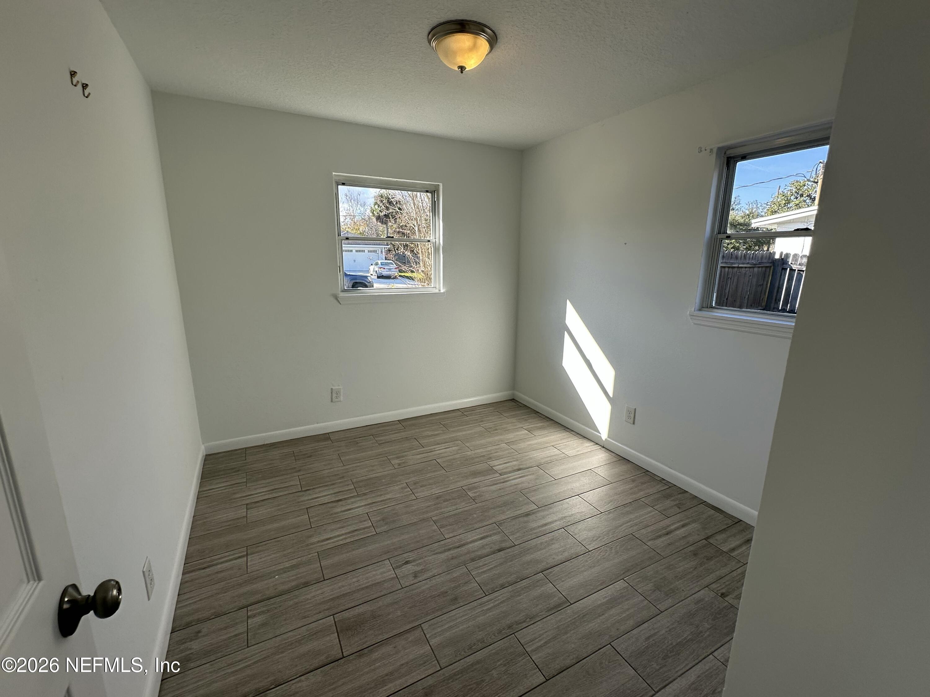 365 Sargo Road Atlantic Beach, FL 32233 - Photo 14 of 23 a view of empty room with wooden floor