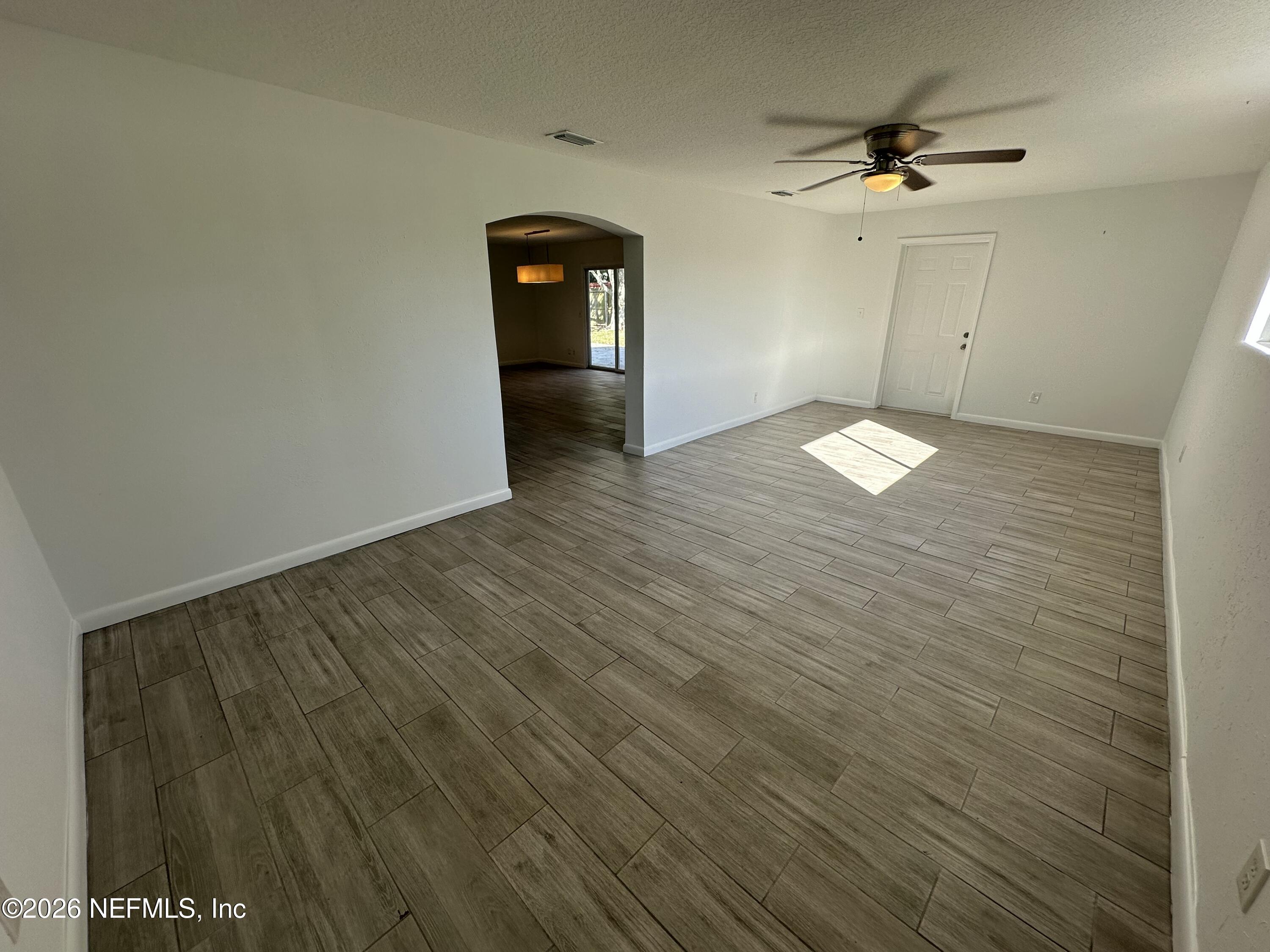 365 Sargo Road Atlantic Beach, FL 32233 - Photo 8 of 23 a view of a livingroom with wooden floor