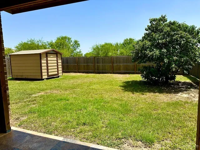 a backyard of a house with lots of green space