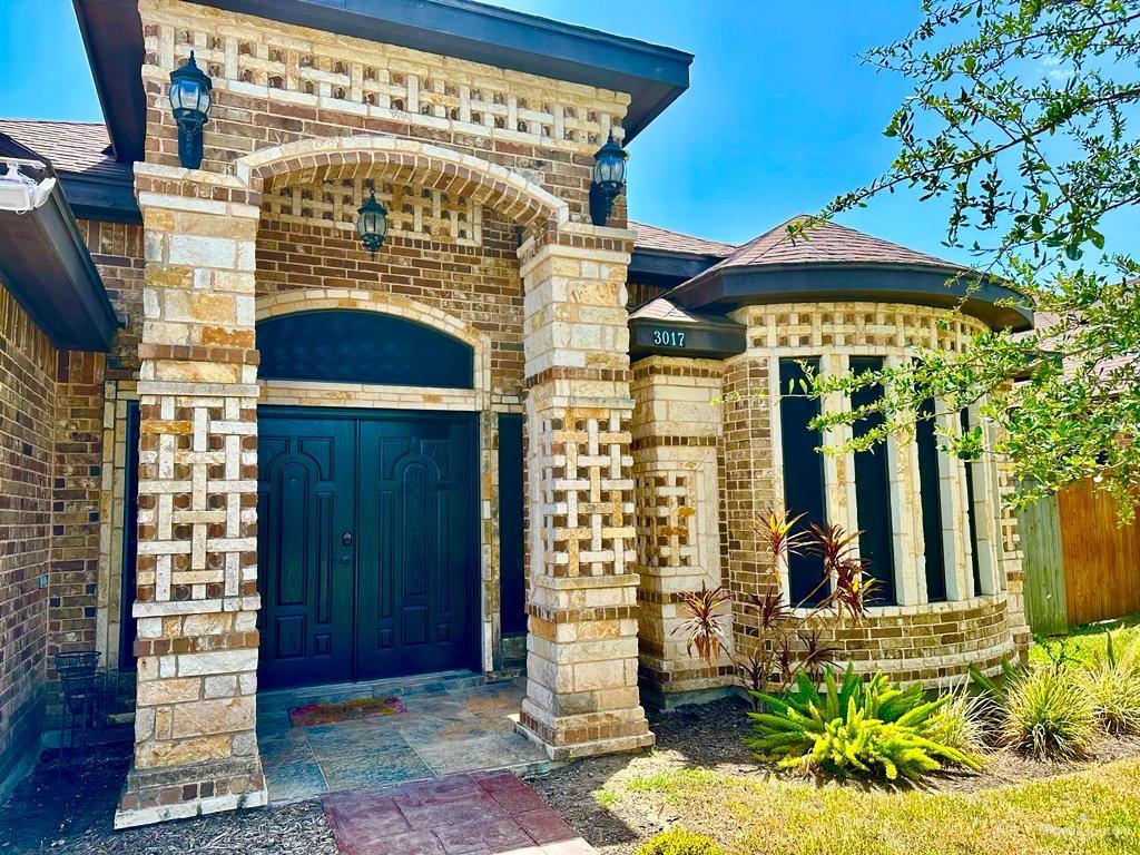 3017 Colorado Avenue McAllen, TX 78504 - Photo 2 of 20 a view of front door and small potted plants