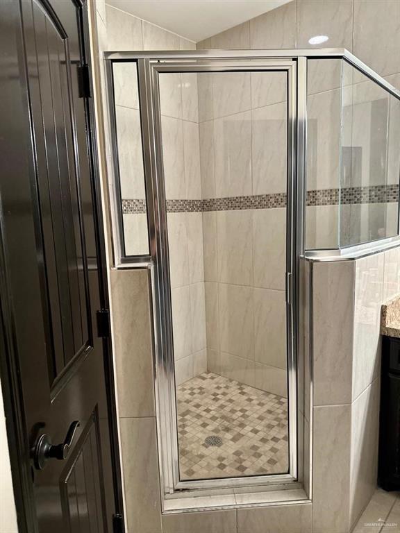 3017 Colorado Avenue McAllen, TX 78504 - Photo 7 of 20 a bathroom with a shower and a glass door