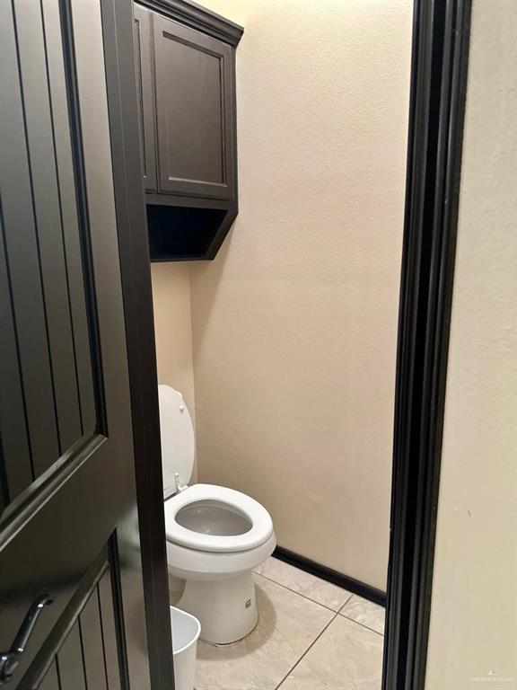 3017 Colorado Avenue McAllen, TX 78504 - Photo 9 of 20 a white toilet sitting next to a sink