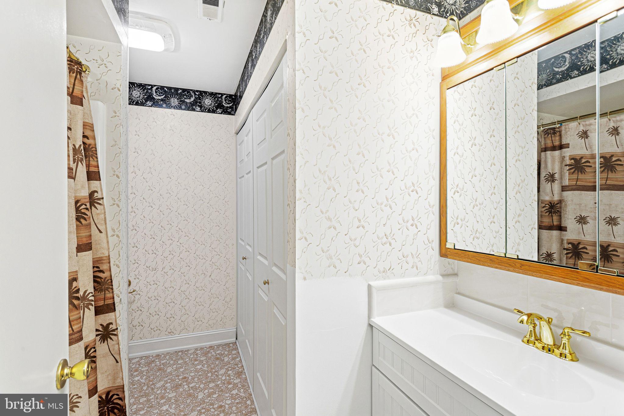 115 East Kings Highway, Unit 271 Maple Shade, NJ 08052 - Photo 13 of 14 a bathroom with a sink and a mirror