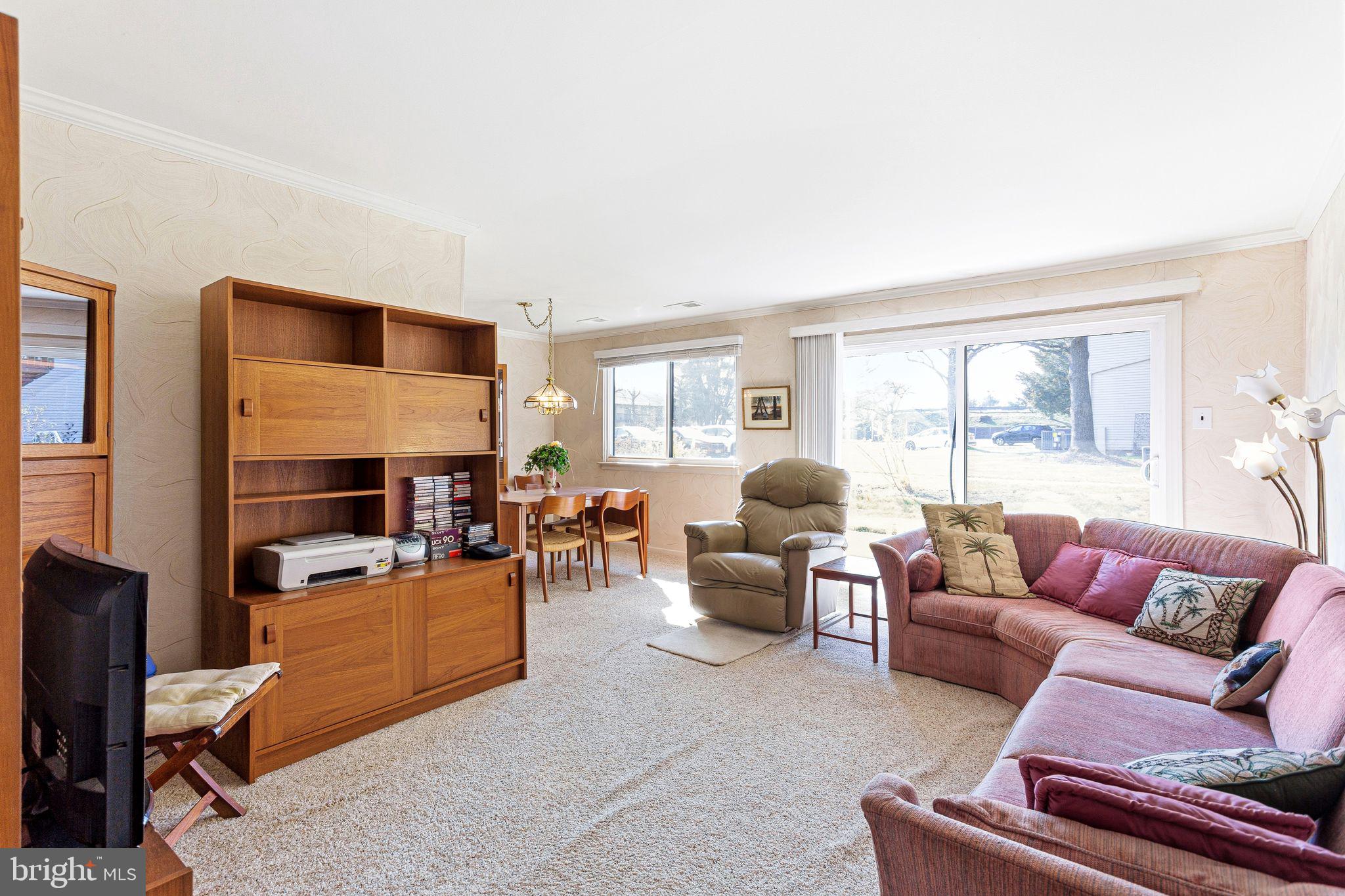 115 East Kings Highway, Unit 271 Maple Shade, NJ 08052 - Photo 4 of 14 a living room with furniture fireplace and a window