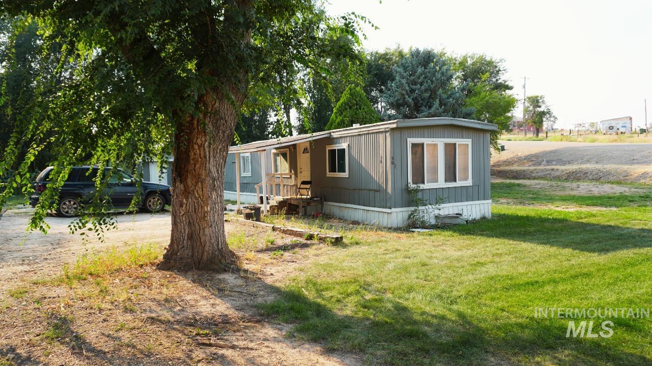 15881 Purple Sage Road, Unit 50 Caldwell, ID 83607 - Photo 1 of 1 Manufactured / mobile home with a front yard