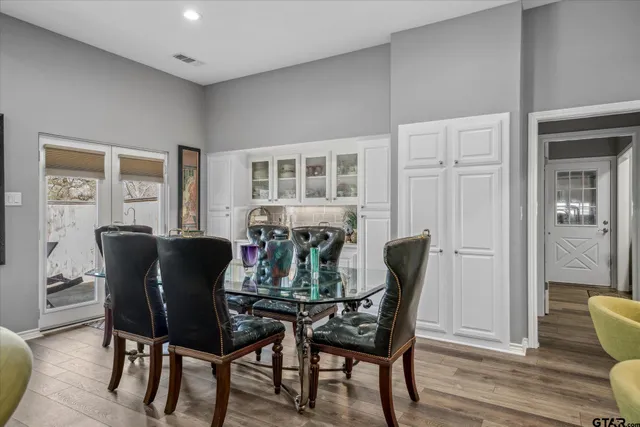 a dining room with furniture and window
