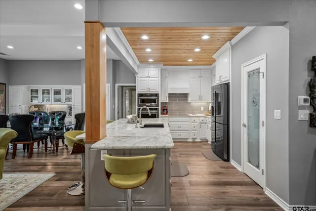 a view of kitchen with dining table and chairs