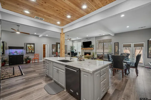 a view of kitchen with sink microwave and stove