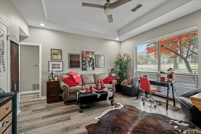 a living room with furniture and a large window