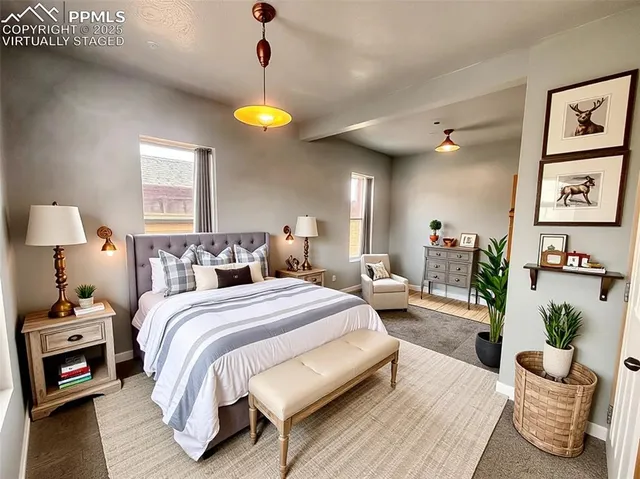 a bedroom with a bed and a chandelier