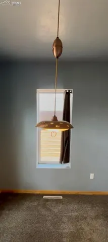 a kitchen with kitchen island stainless steel appliances a sink and a counter top