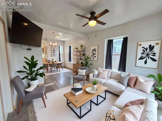 a living room with furniture and a flat screen tv