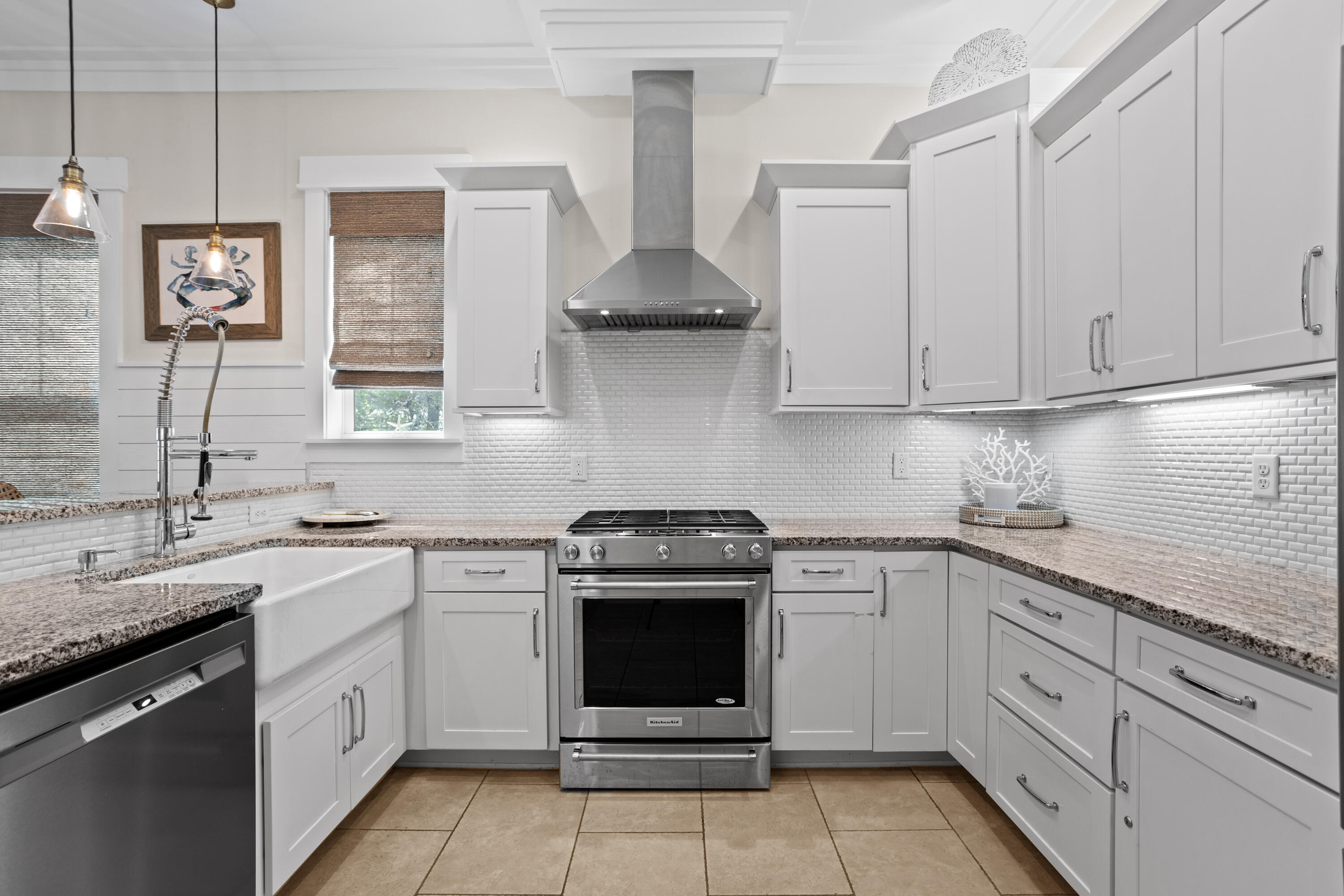 14 The Heron Cove Inlet Beach, FL 32461 - Photo 11 of 56 a kitchen with stainless steel appliances granite countertop white cabinets and a sink