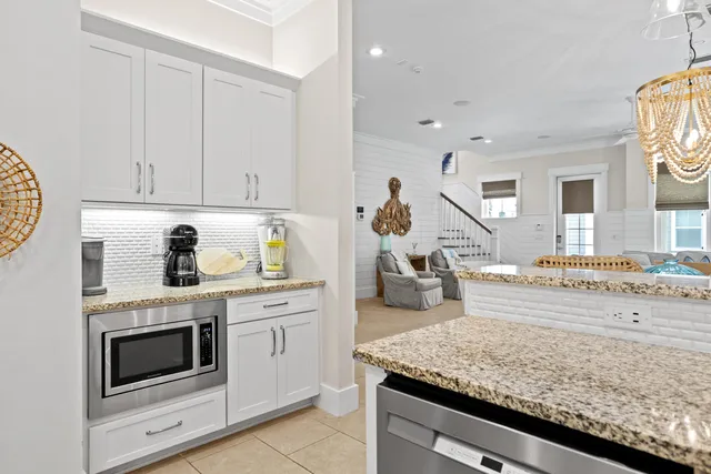 a kitchen with a stove and a white cabinets