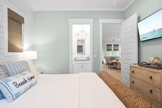 a bedroom with a bed a couch and dresser