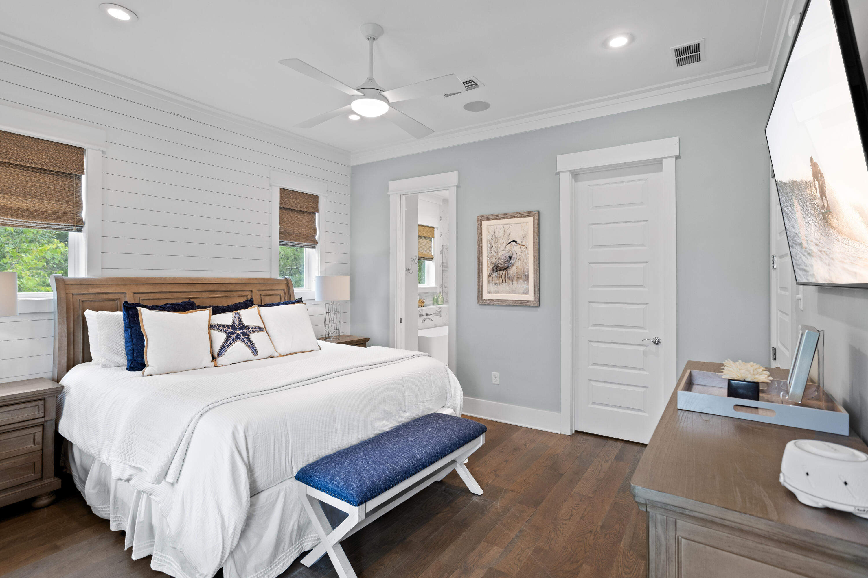 14 The Heron Cove Inlet Beach, FL 32461 - Photo 24 of 56 a bedroom with a bed and wooden floor