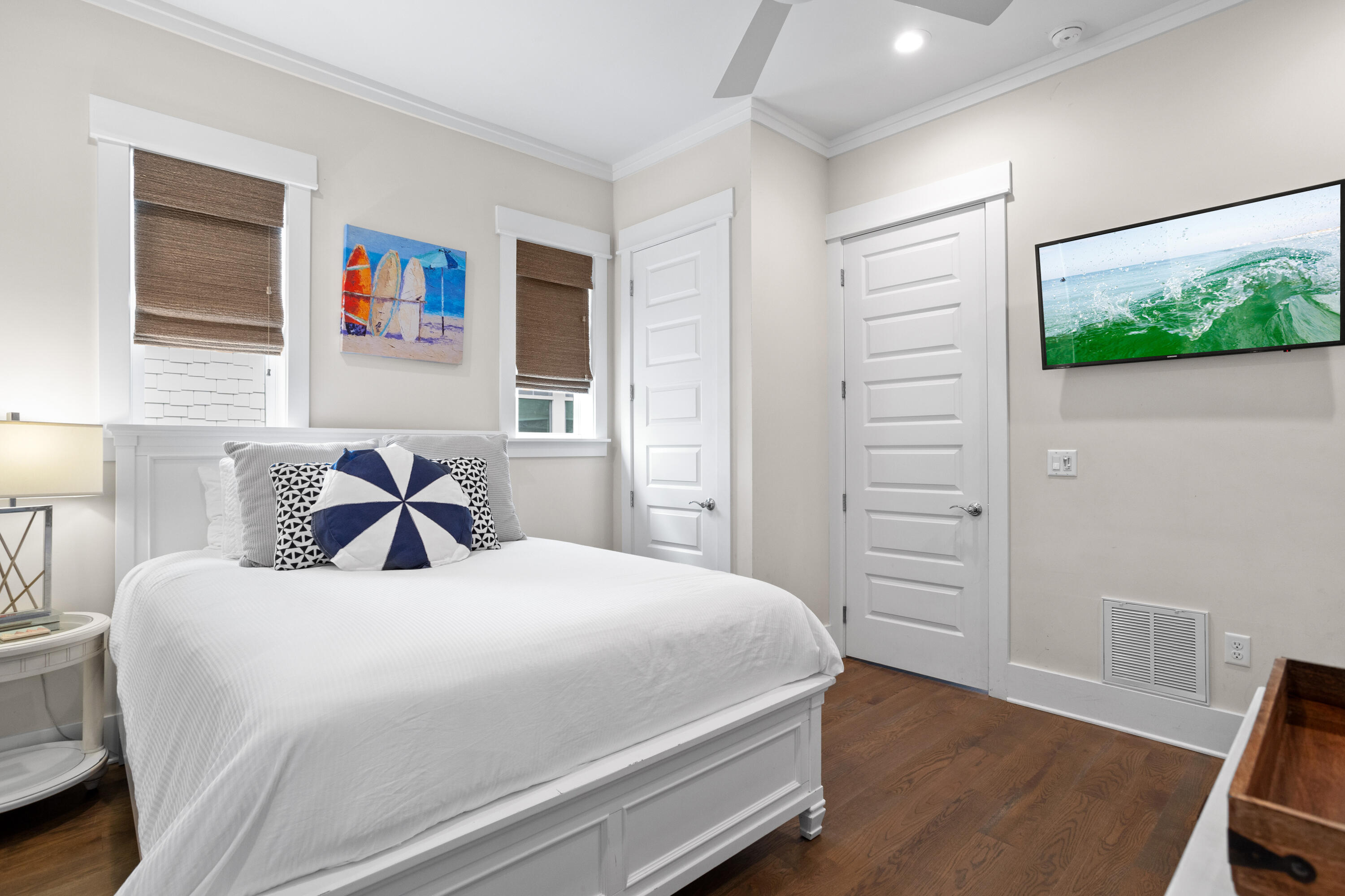 14 The Heron Cove Inlet Beach, FL 32461 - Photo 29 of 56 a bedroom with a bed and wooden floor