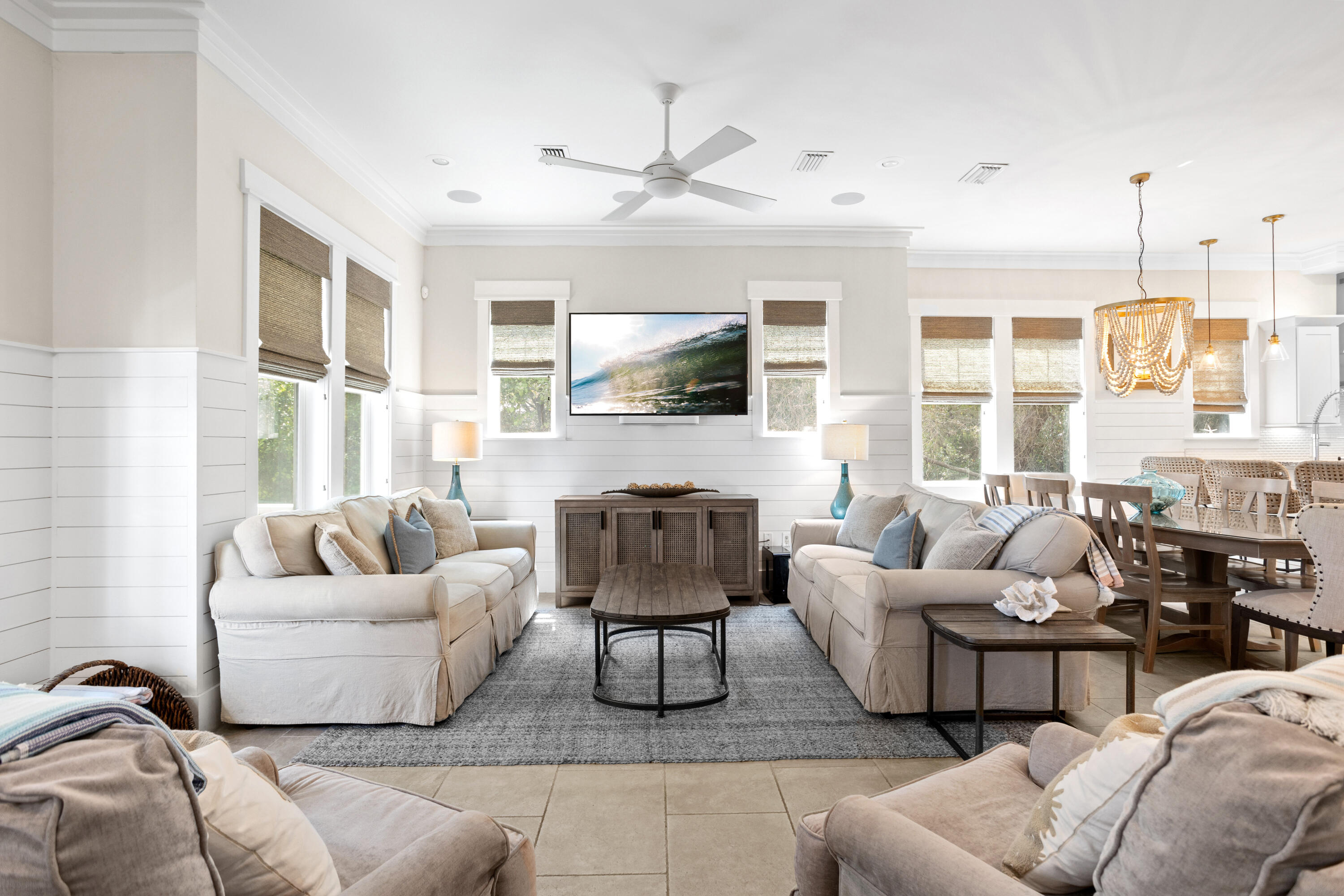 14 The Heron Cove Inlet Beach, FL 32461 - Photo 4 of 56 a living room with furniture a large window and a flat screen tv