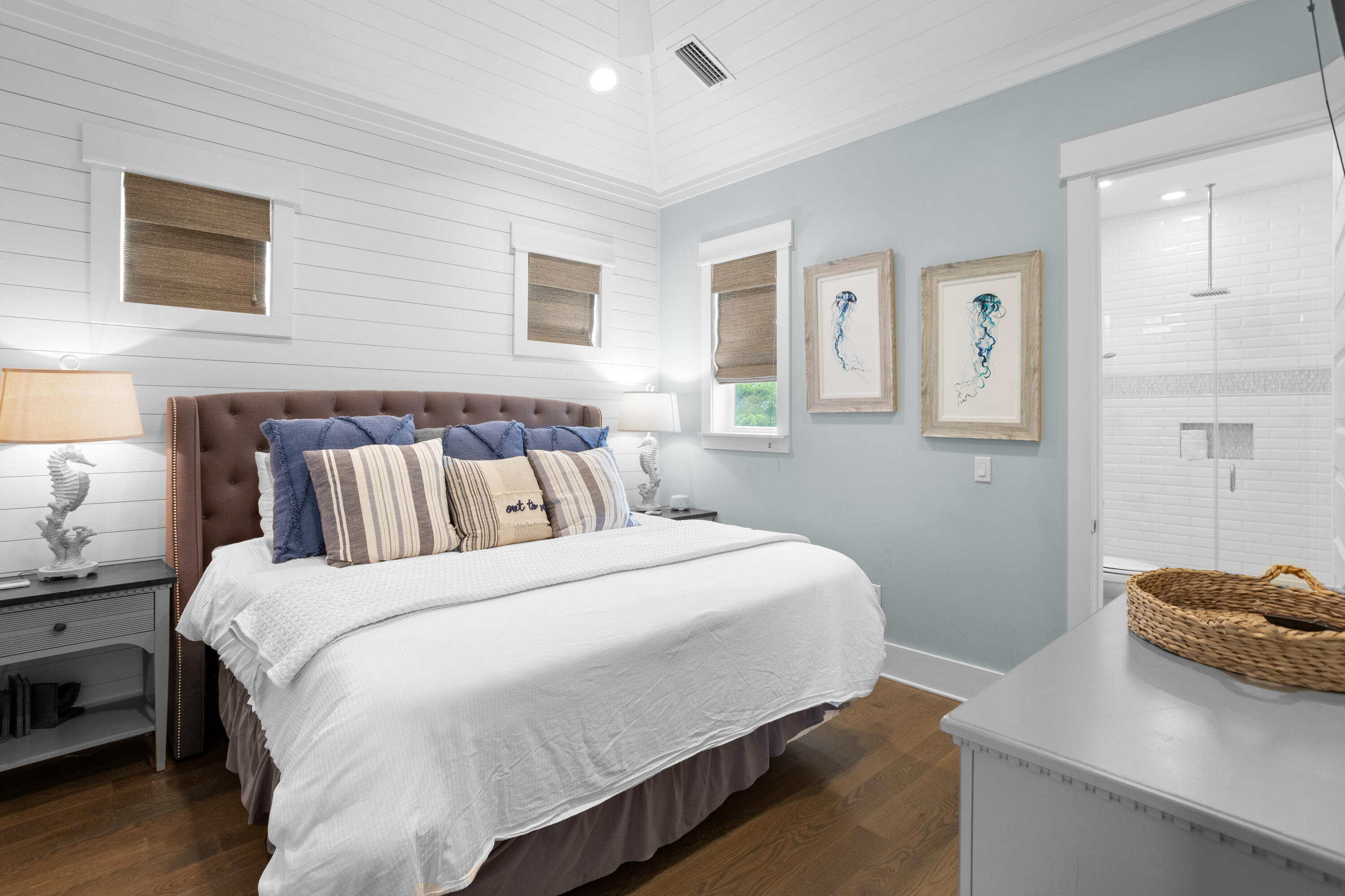 14 The Heron Cove Inlet Beach, FL 32461 - Photo 41 of 56 a bedroom with a bed and wooden floor