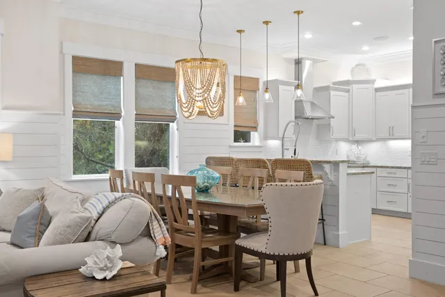 a view of balcony with two chairs and a large window