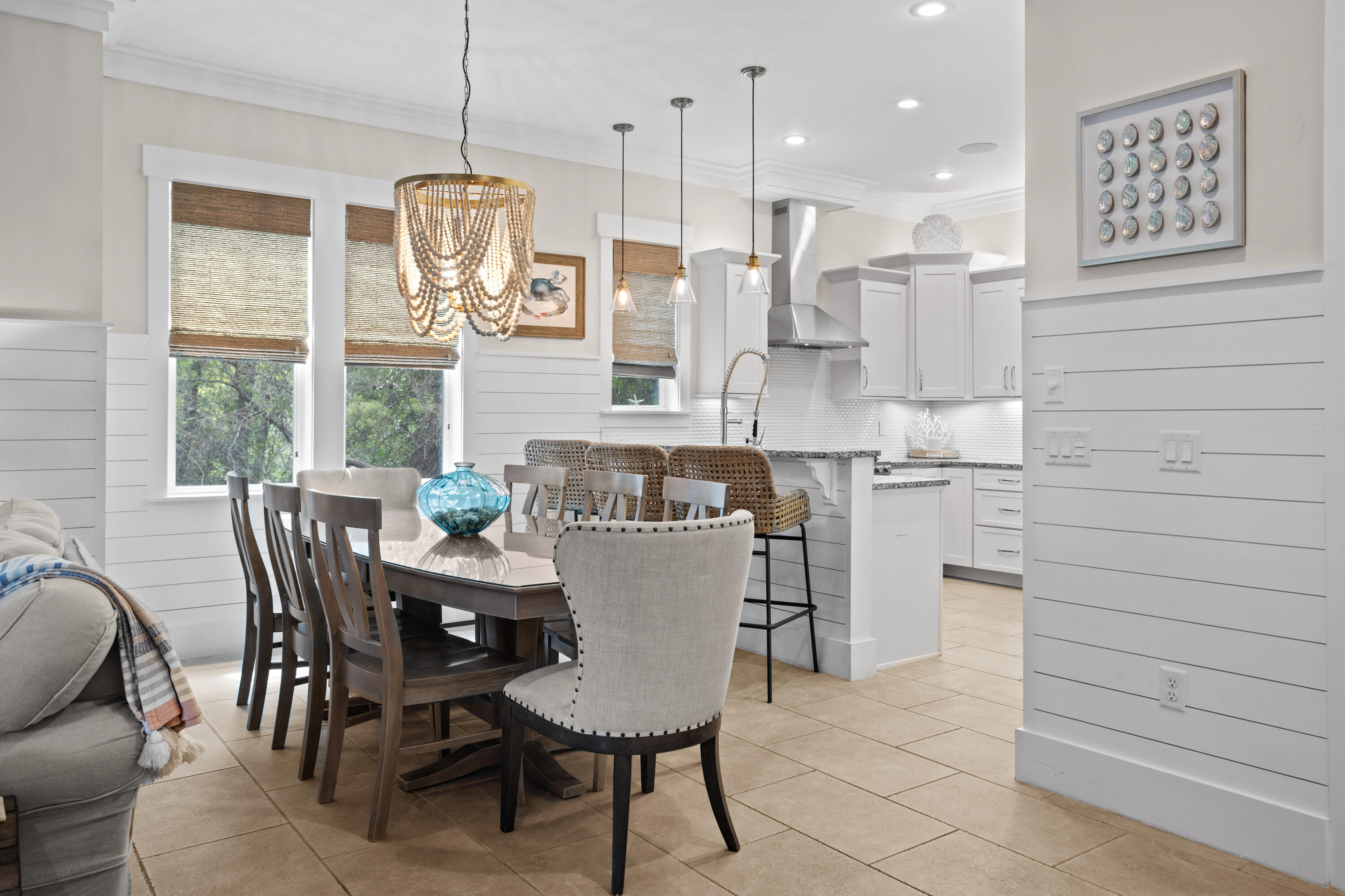 14 The Heron Cove Inlet Beach, FL 32461 - Photo 9 of 56 a dining table chairs and a chandelier