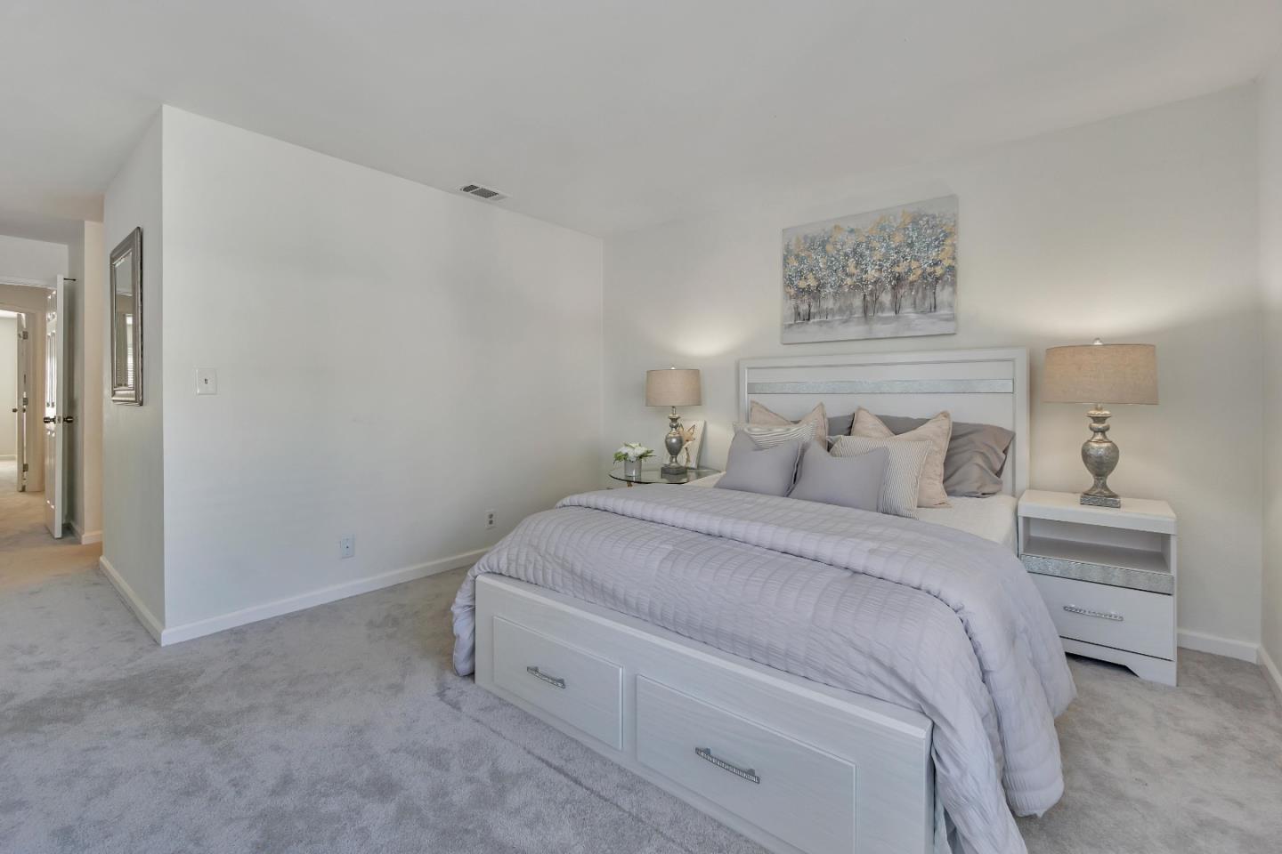 1677 Geary Road Walnut Creek, CA 94597 - Photo 19 of 38 a bedroom with a bed and a painting on the wall