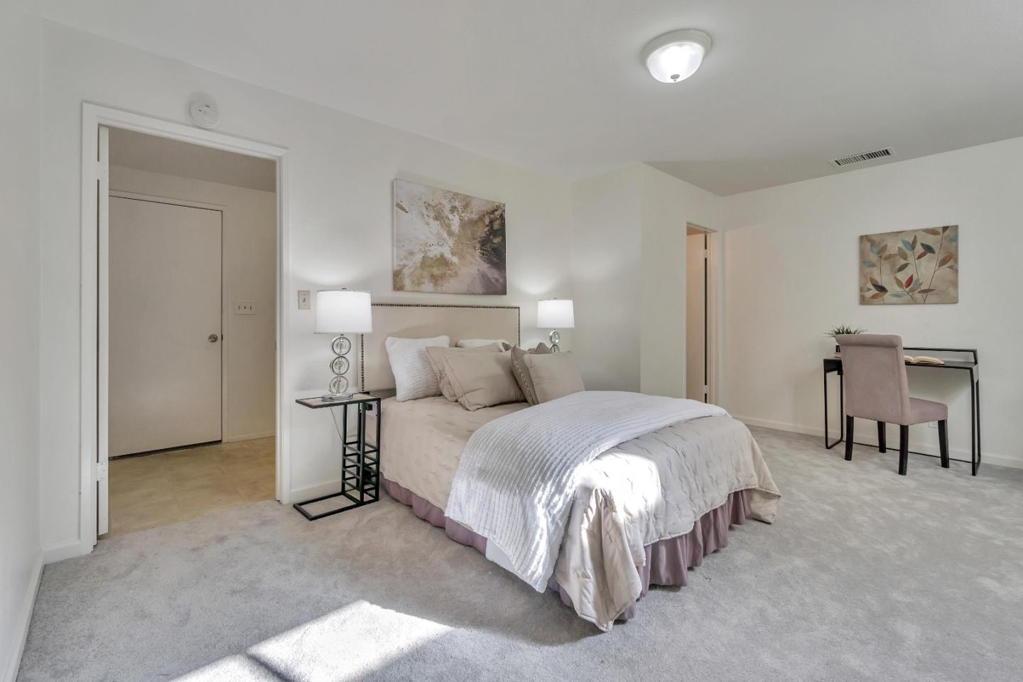 1677 Geary Road Walnut Creek, CA 94597 - Photo 26 of 38 a bedroom with a bed and a lamp