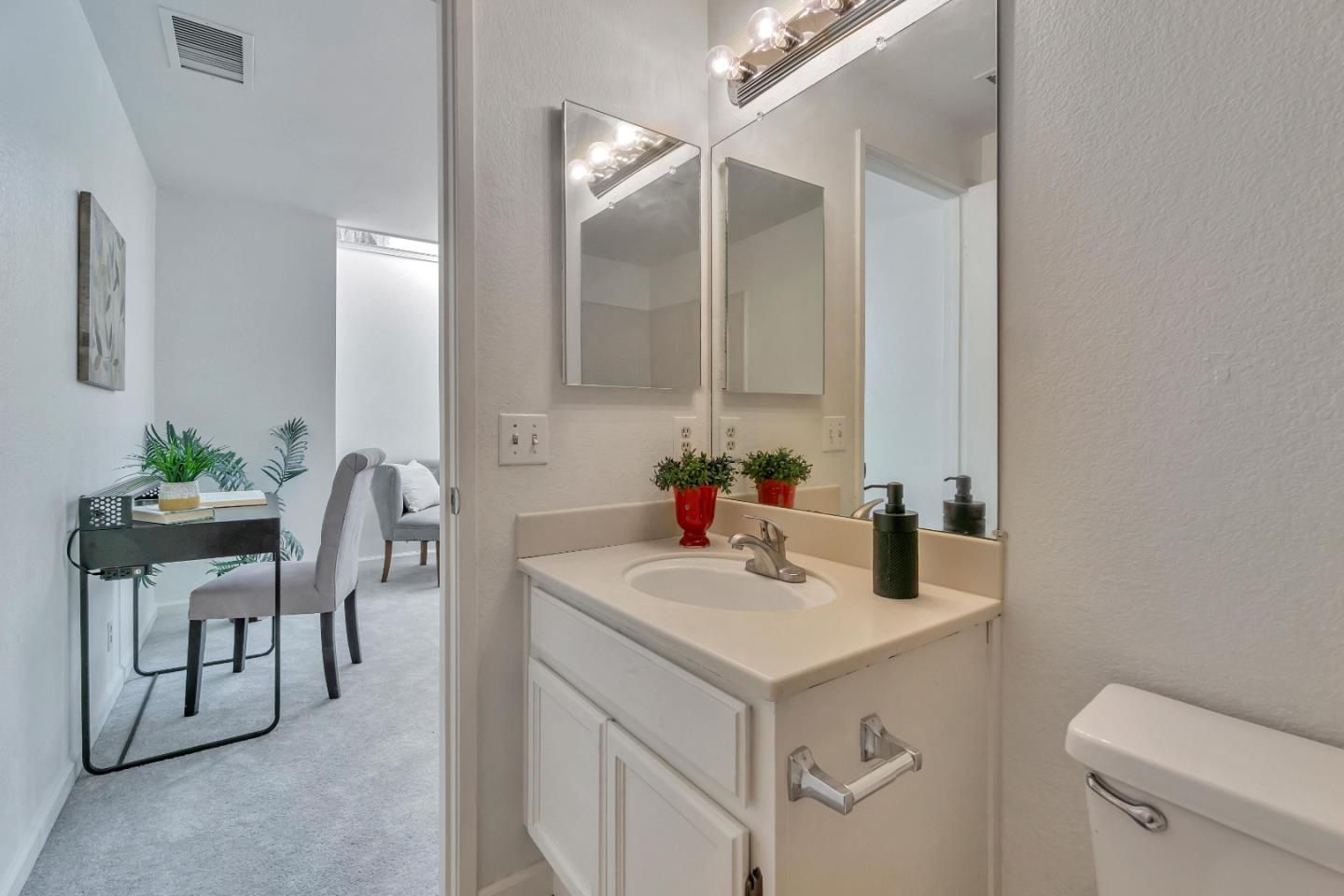 1677 Geary Road Walnut Creek, CA 94597 - Photo 29 of 38 a bathroom with a sink and a toilet