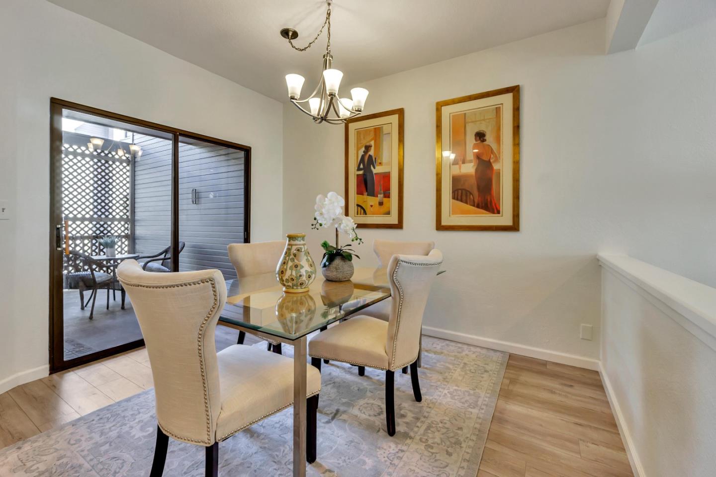 1677 Geary Road Walnut Creek, CA 94597 - Photo 7 of 38 a view of a dining room with furniture wooden floor and a chandelier