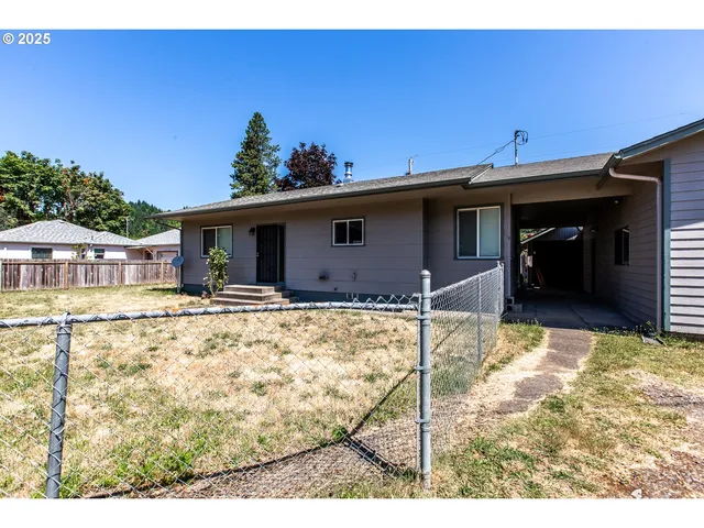 a view of house with yard
